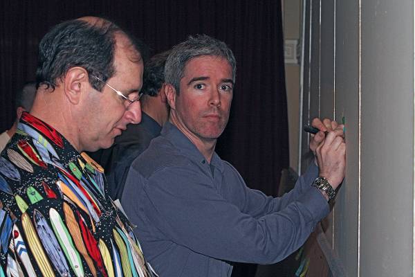 Mark Gibson, Ted McFadden [drawing on wall],  | DSTC Farewell Symposium, 28 July 2005  | 