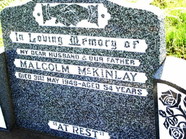 Malcolm MCKINLAY,  | husband father,  | died 31 May 1949 aged 54 years;  | Malcolm MCKINLAY,  | son brother,  | killed in action Balikpapan 1 July 1945  | aged 22 years;  | Bell cemetery, Wambo Shire  | 
