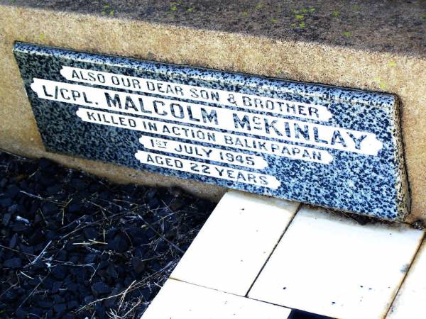 Malcolm MCKINLAY,  | husband father,  | died 31 May 1949 aged 54 years;  | Malcolm MCKINLAY,  | son brother,  | killed in action Balikpapan 1 July 1945  | aged 22 years;  | Bell cemetery, Wambo Shire  | 