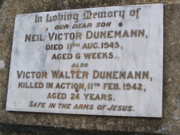 Neil Victor DUNEMANN, son,  | died 11 Aug 1945 aged 6 weeks;  | Victor Walter DUNEMANN,  | killed in action 11 Feb 1942 aged 24 years;  | Bergen Djuan cemetery, Crows Nest Shire  | 