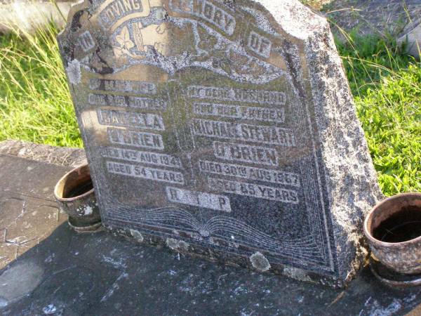 Isabella O'BRIEN, wife mother,  | died 14 Aug 1941 aged 54 years;  | Michael Stewart O'BRIEN, husband father,  | died 30 Aug 1967 aged 85 years;  | Gleneagle Catholic cemetery, Beaudesert Shire  | 