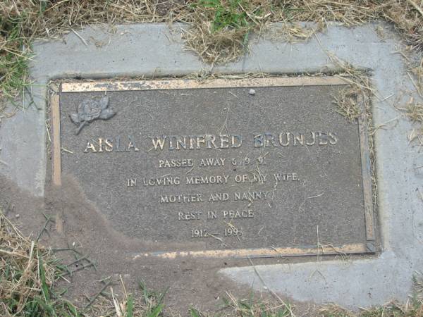 Aisla Winifred BRUNJES,  | 1912 - 1991,  | died 5-9-91,  | wife mother nanny;  | Goomeri cemetery, Kilkivan Shire  | 