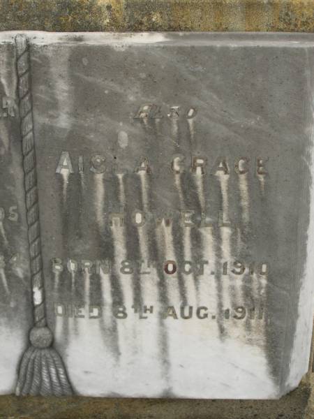 Theophilus HOWELL,  | died 11 March 1902 aged 77 years,  | born in Wales,  | lived in Qld 50 years;  | Anne HOWELL,  | wife,  | died 13 Jan 1927 in 85th year,  | residing in Qld 74 years;  | Joseph Charles HOWELL,  | born Killarney 24-10-1872,  | died Brisbane 11-3-1940,  | buried Toowong;  | William Arthur Melrose Octavius,  | son of Theophilus & Ann HOWELL of this place,  | died 1 April 1881 aged 11 months 11 days;  | Anna Douglas,  | wife of T.J. HOWELL  Melrose ,  | died 7 Oct 1928 aged 66 years;  | Theophilus John HOWELL,  | born Fassifern Qld 15 July 1862,  | died Bordertown SA 17 Dec 1935;  | Archibald Dunbar HOWELL,  | born 17 July 1905,  | died 25 March 1934;  | Aisla Grace HOWELL,  | born 8 Oct 1910,  | died 8 Aug 1911;  | Killarney cemetery, Warwick Shire  | 