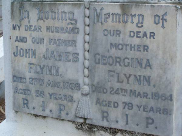 John James FLYNN,  | husband father,  | died 27 Aug 1938 aged 56 years;  | Georgina FLYNN,  | mother,  | died 24 Mar 1964 aged 79 years;  | Lawnton cemetery, Pine Rivers Shire  | 