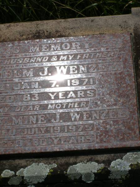 Wilhelm J. WENZEL,  | husband father,  | died 7 Jan 1971 aged 83 years;  | Wilhelmine J. WENZEL,  | mother,  | died 19 July 1975 aged 80 years;  | Milbong St Luke's Lutheran cemetery, Boonah Shire  | 