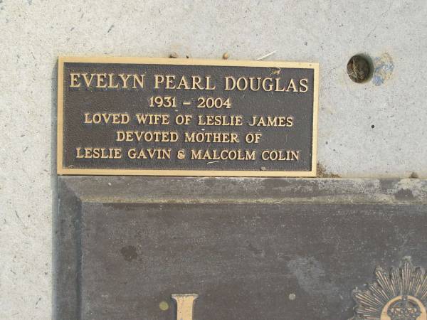 L.J. DOUGLAS,  | died 4 March 1986 aged 63 years;  | Evelyn Pearl DOUGLAS,  | wife of Leslie James,  | mother of Leslie Gavin & Malcolm Colin;  | Mudgeeraba cemetery, City of Gold Coast  | 