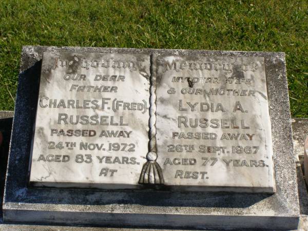 Charles F. (Fred) RUSSELL,  | father,  | died 24 Nov 1972 aged 83 years;  | Lydia A. RUSSELL,  | wife mother,  | died 26 Sept 1967 aged 77 years;  | Pimpama Island cemetery, Gold Coast  | 