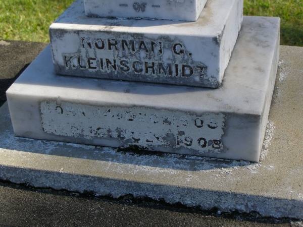 Norman G. KLEINSCHMIDT,  | born 14 Dec 1905,  | died 12 July 1908;  | Carl Friedrich KLEINSCHMIDT,  | born 7 Sept 1820,  | died 19 Aug 1908;  | Justine Caroline KLEINSCHMIDT (nee BRAUN),  | wife,  | born 24 Oct 1830,  | died 25 July 1909;  | Pimpama Island cemetery, Gold Coast  | 