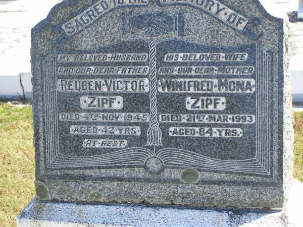 Reuben Victor ZIPF,  | husband father,  | died 4 Nov 1945 aged 42 years;  | Winifred Mona ZIPF,  | wife mother,  | died 21 Mar 1993 aged 84 years;  | Pimpama Island cemetery, Gold Coast  | 