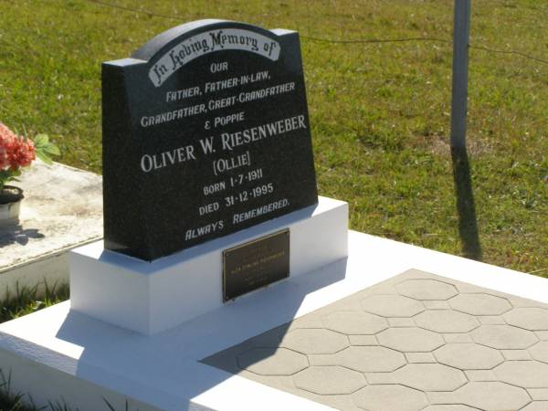 Oliver W. (Ollie) RIESENWEBER,  | father father-in-law grandfather great-grandfather poppie,  | born 1-7-1911,  | died 31-12-1995;  | Glen Dowling RIESENWEBER,  | 7-2-1938 -4-7-2007,  | eldest son of Ollie;  | Pimpama Island cemetery, Gold Coast  | 