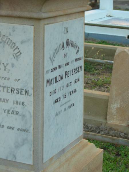 Mads C. PETERSEN,  | faher,  | died 17 July 1946 aged 91 years;  | Lilley,  | daughter of M.C. & M. PETERSEN,  | died 4 May 1916 in 25th year;  | Matilda PETERSEN,  | wife mother,  | died 17 Oct 1934 aged 75 years;  | Bald Hills (Sandgate) cemetery, Brisbane  | 