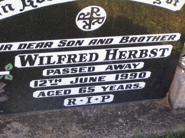 Wilfred HERBST,  | son brother,  | died 12 June 1990 aged 65 years;  | Tarampa Apostolic cemetery, Esk Shire  | 
