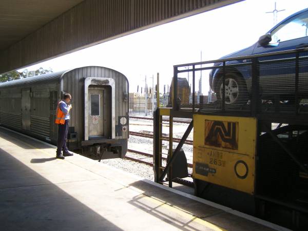 Our car (top front) loaded onto the motorail  | of the Indian Pacific, East Perth railway station  | 