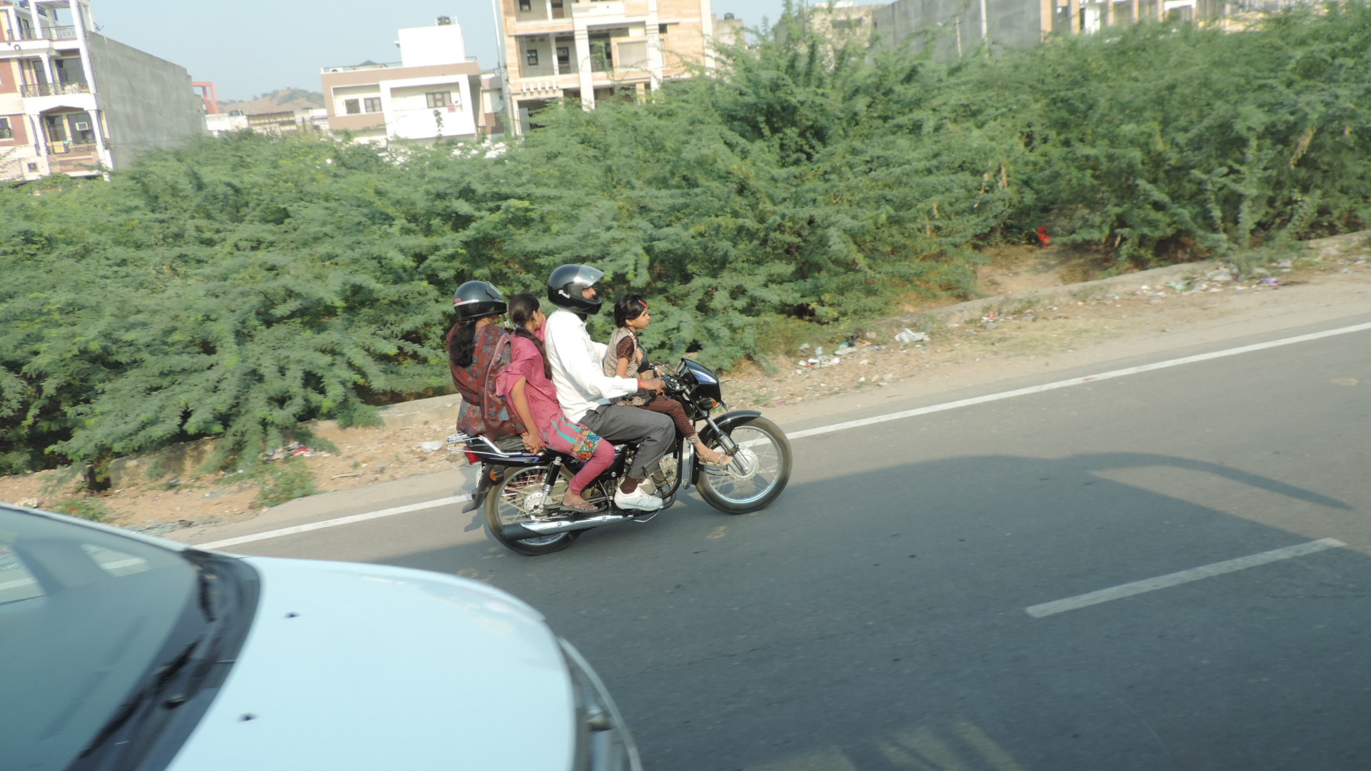 family on motor bike, probably has long seat option