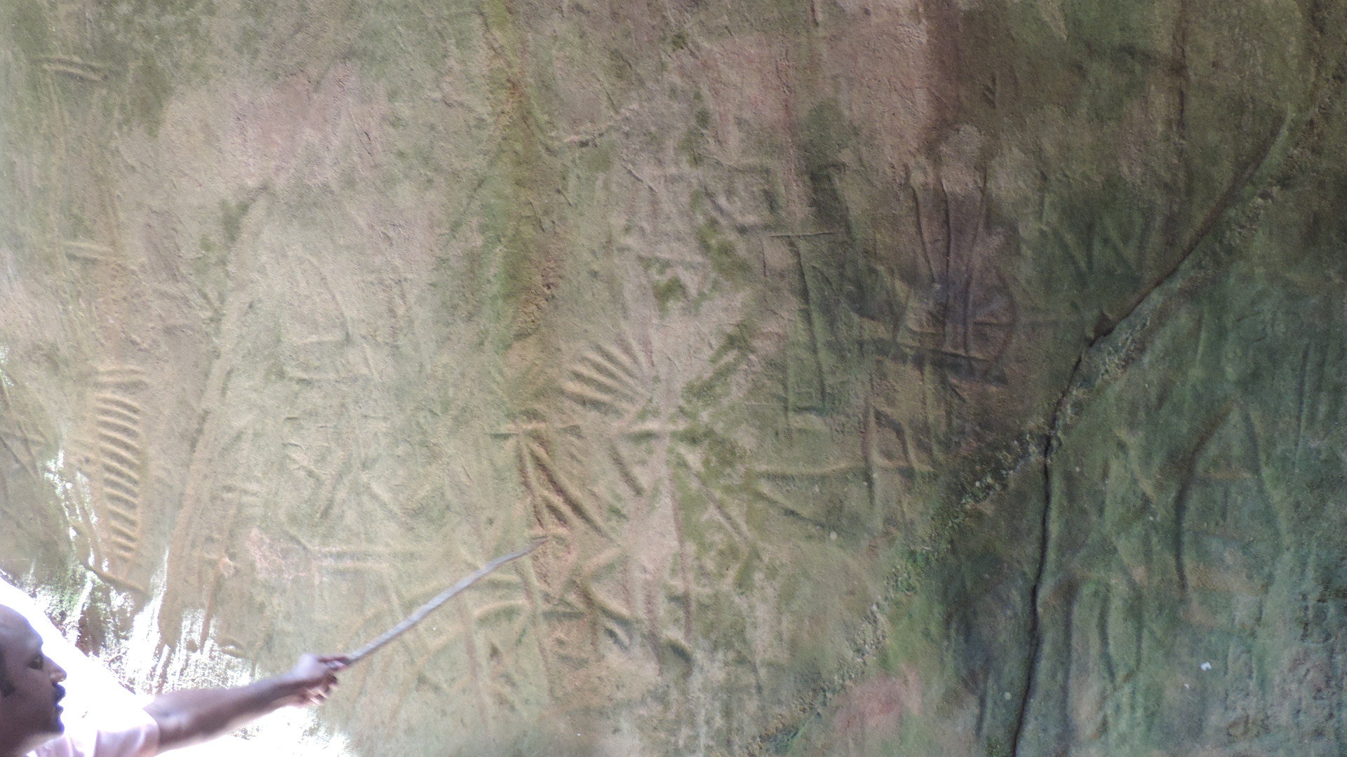 Several thousand year old rock carvings of people dancing